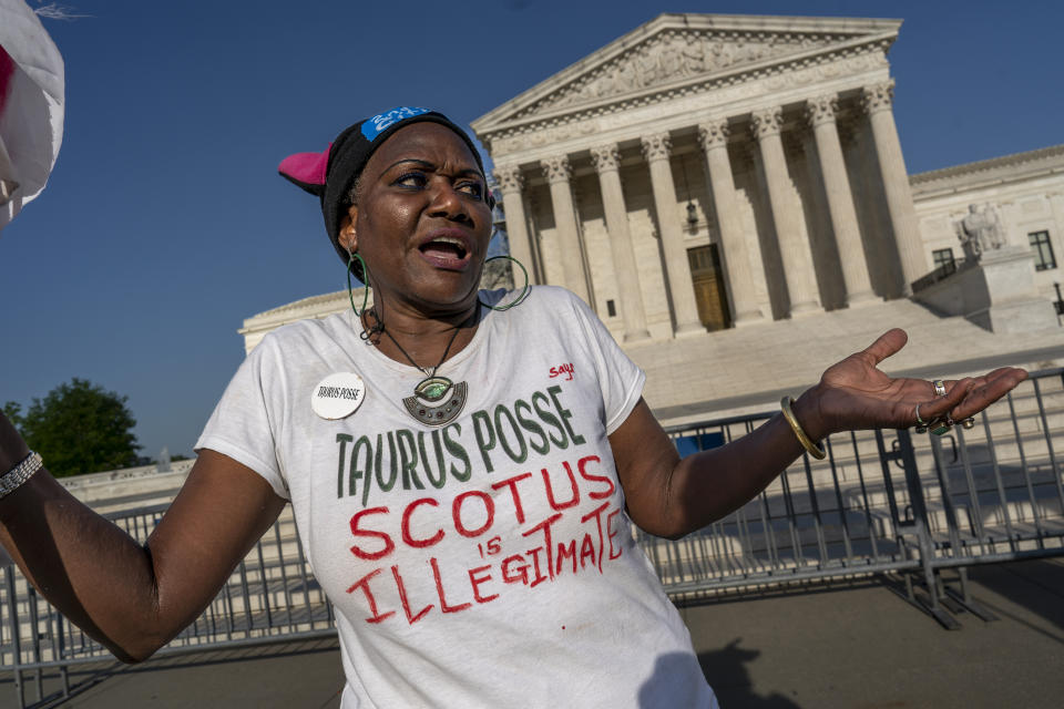 Activist Nadine Seiler of Waldorf, Md., demonstrates in front of the Supreme Court on Capitol Hill in Washington, Thursday, April 20, 2023, as she laments the absence of people to protest the conservative majority on the high court. Justices are leaving women's access to an abortion pill untouched until at least Friday, while they consider whether to allow restrictions on mifepristone to take effect. (AP Photo/J. Scott Applewhite)