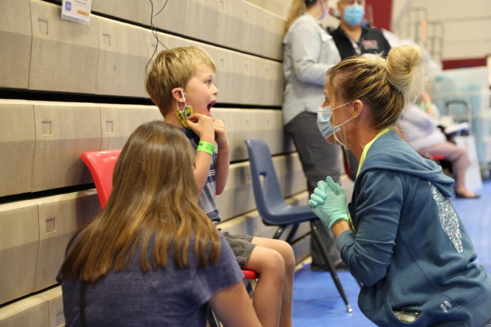 A dental patient is examined at a Remote Area Medical pop-up clinic. A free dental clinic will be available in Nashville on Saturday, March 2, 2024 beginning at 6 a.m.