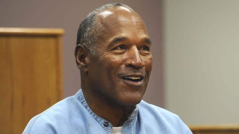 FILE – In this July 20, 2017, file photo, former NFL football star O.J. Simpson appears via video for his parole hearing at the Lovelock Correctional Center in Lovelock, Nev. The 74-year-old former football hero, acquitted California murder defendant and convicted Las Vegas armed robber was granted good behavior credits and discharged from parole effective Dec. 1, the day after a hearing before the Nevada state Board of Parole, Kim Yoko Smith, spokeswoman for the Nevada State Police, said Tuesday, Dec. 14, 2021. (Jason Bean/The Reno Gazette-Journal via AP, Pool, File)