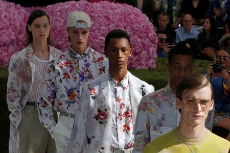 Models present creations by designer Kim Jones for Dior Homme collection as part of their Spring/Summer 2019 collection show during Men's Fashion Week in Paris, France, June 23, 2018. REUTERS/Pascal Rossignol