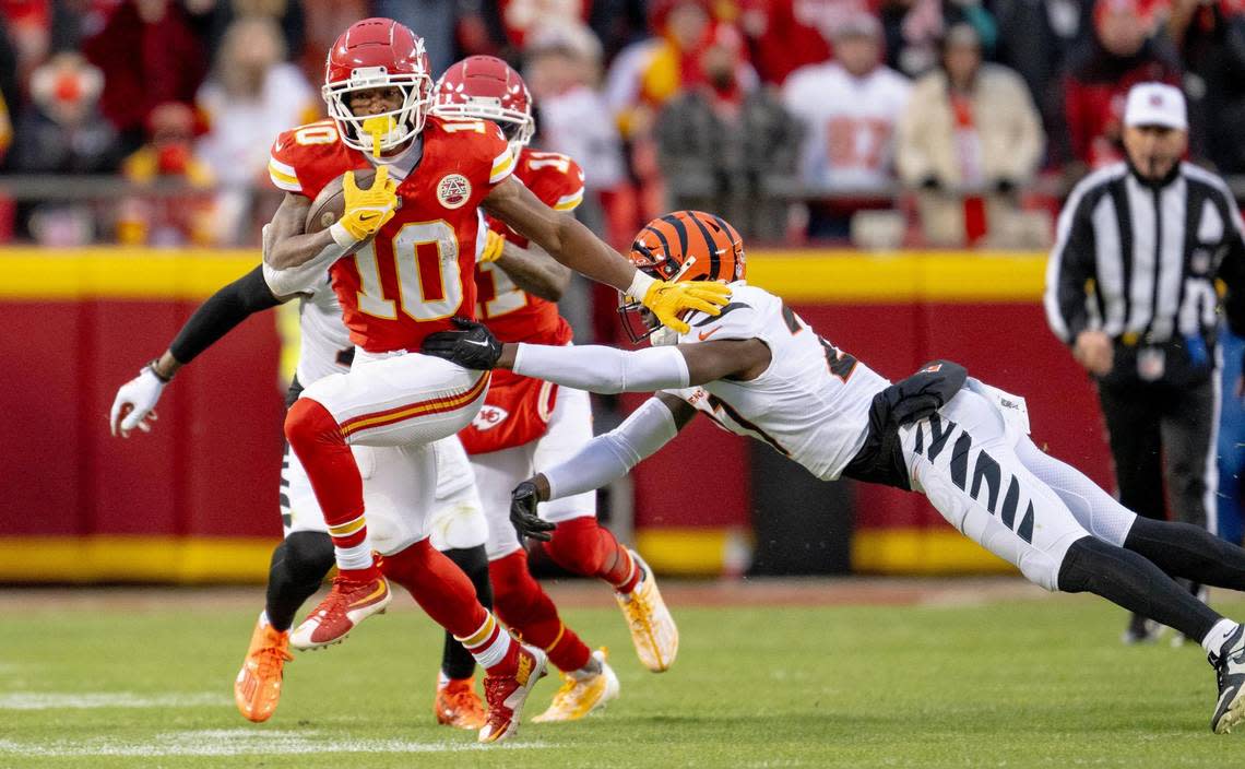 Kansas City Chiefs running back Isiah Pacheco (10) breaks free from Cincinnati Bengals safety Jordan Battle (27) during an NFL football game at GEHA Field at Arrowhead Stadium on Sunday, Dec. 31, 2023, in Kansas City.