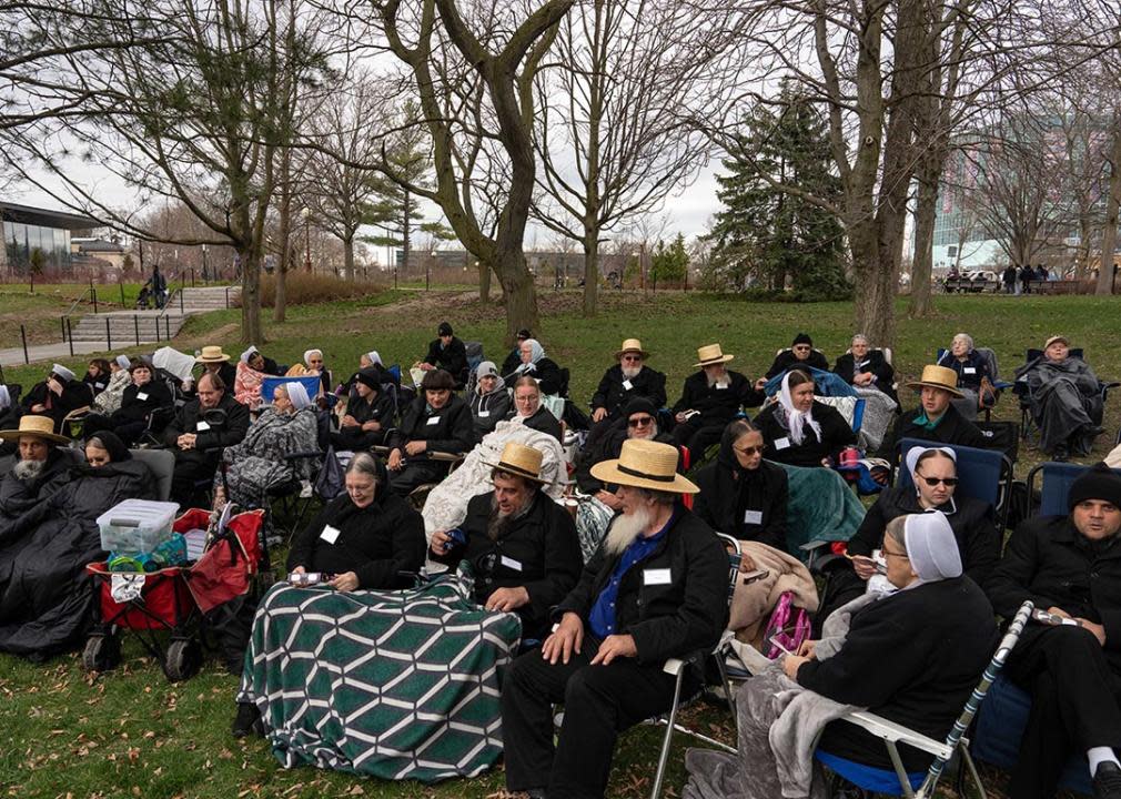 Members of the Amish community sit to watch the Solar Eclipse on April 8, 2024 in Niagara Falls, New York. 