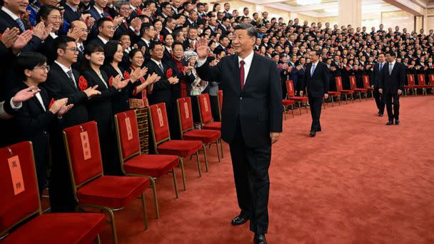 PHOTO: Chinese President Xi Jinping, center, and his premier Li Keqiang, center right, meet with representatives of model civil servants during a national award ceremony held at the Great Hall of the People in Beijing, Aug. 30, 2022.  (Li Xueren/Xinhua via AP, File)