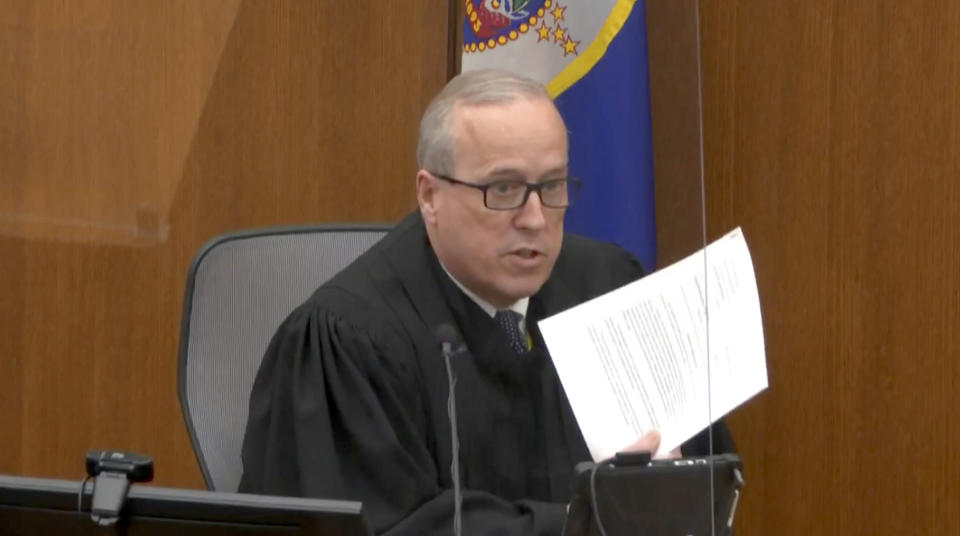 In this image from video, Hennepin County Judge Peter Cahill reads instructions to the jury before closing arguments, Monday, April 19, 2021, in the trial of former Minneapolis police officer Derek Chauvin at the Hennepin County Courthouse in Minneapolis. Chauvin is charged in the May 25, 2020 death of George Floyd. (Court TV via AP, Pool)