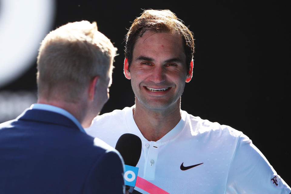 Roger Federer (pictured) speaking to Jim Courier at the Australian Open.