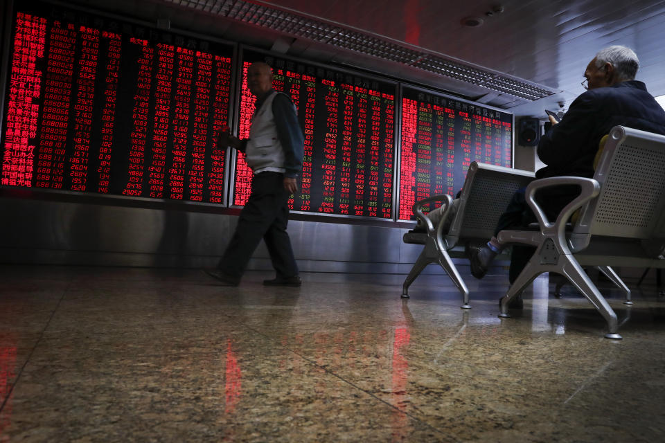 Chinese investors monitor stock prices at a brokerage house in Beijing, Thursday, Nov. 28, 2019. Asian shares were mostly lower on Thursday after President Donald Trump signed a bill expressing support for human rights in Hong Kong. (AP Photo/Andy Wong)