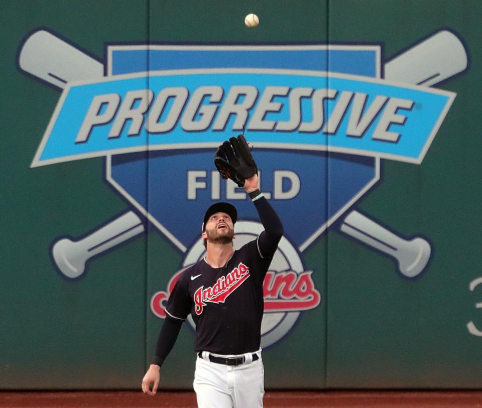 Cleveland right fielder Tyler Naquin gets under a fly ball hit by the Pittsburgh Pirates' Bryan Reynolds during the 2020 season in Cleveland.