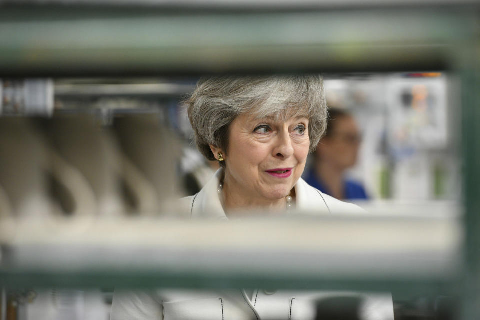 Britain's Prime Minister Theresa May looks on, during a visit to the Portmeirion pottery factory in Stoke-on-Trent, England, Monday,  Jan. 14, 2019. May is due to make a statement in the House of Commons on Monday afternoon, a day before lawmakers are due to vote on her EU divorce deal. May argues that defeating the deal could open the way for EU-backing legislators to block Brexit.  (Ben Birchall/PA via AP)