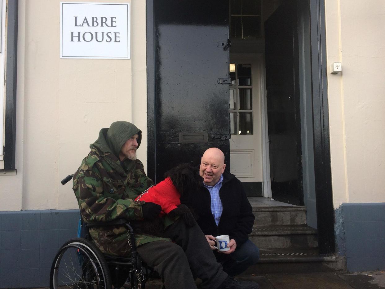 Liverpool Mayor Joe Anderson (right) sits with one of the new residents at the Labre House homeless shelter in the city centre: Liverpool Council