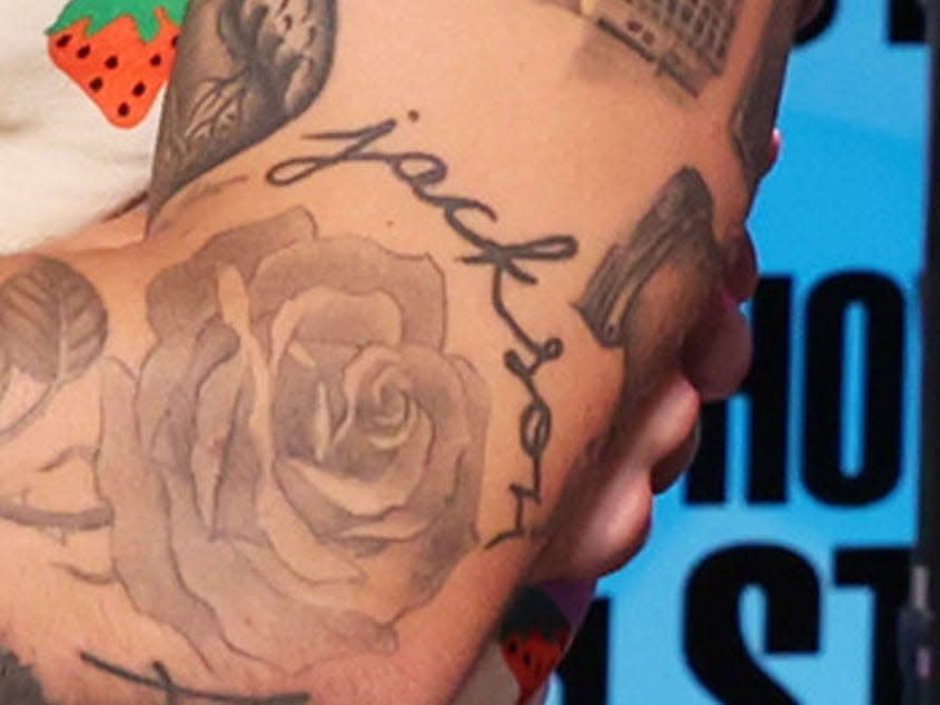 A tattoo of the name Jackson, seen on Harry Styles' left arm.