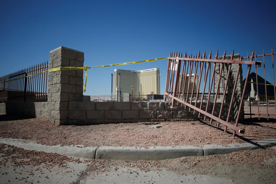 <p>A broken fence is pictured leading from the parking lot near the site of the Route 91 music festival mass shooting in Las Vegas, Nev., Oct. 5, 2017. (Photo: Chris Wattie/Reuters) </p>