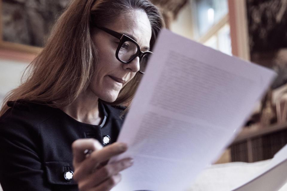 A woman reading documents