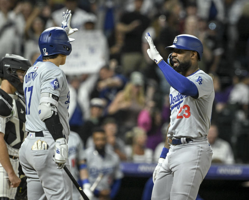 DENVER, CO - JUNE 18: Jason Heyward (23) of the Los Angeles Dodgers celebrates at home plate with Shohei Ohtani (17) after hitting a grand slam off of Tyler Kinley (40) of the Colorado Rockies during the ninth inning of the Dodgers' 11-9 win at Coors Field in Denver on Tuesday, June 18, 2024. The Dodgers rallied by way of a seven-run night to edge the Rockies, who held a 9-4 lead entering the final frame. (Photo by AAron Ontiveroz/The Denver Post)