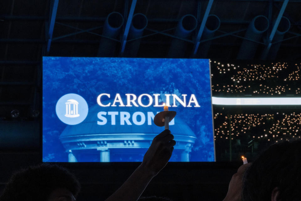 University of North Carolina-Chapel Hill students, faculty and family hold a candlelight vigil, Friday, Aug 30, 2023, in Chapel Hill, N.C., in honor of professor Zijie Yan who was shot and killed on campus on Monday. (Travis Long/The News & Observer via AP)