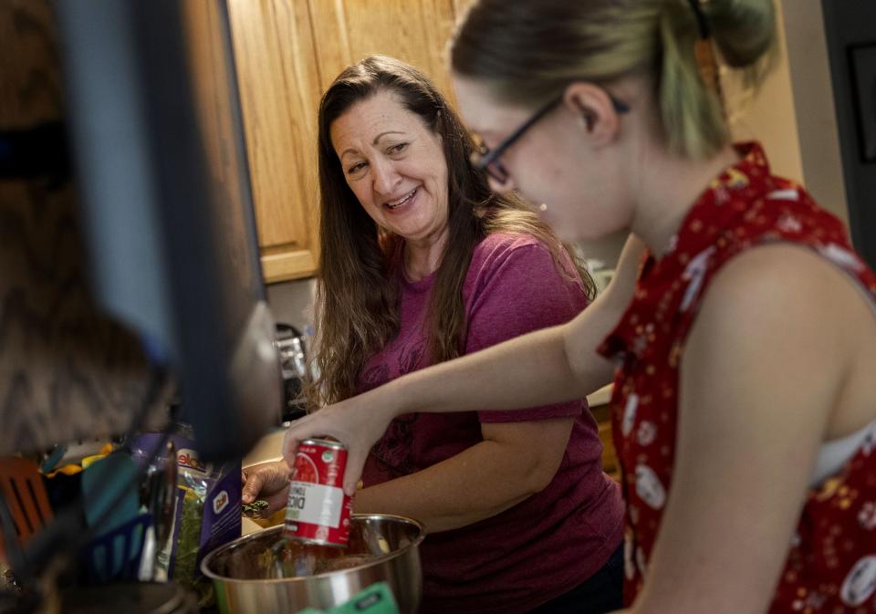 Martha McIff smiles at her daughter Cassie as they prepare stuffed peppers for dinner at their Orem home on Thursday, July 6, 2023. | Laura Seitz, Deseret News