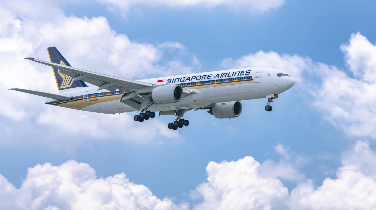 Ho Chi Minh City, Vietnam - June 8th, 2019: Airplane Boeing 777 of Singapore Airlines flying through clouds sky prepare to landing at Tan Son Nhat International Airport, Ho Chi Minh City, Vietnam