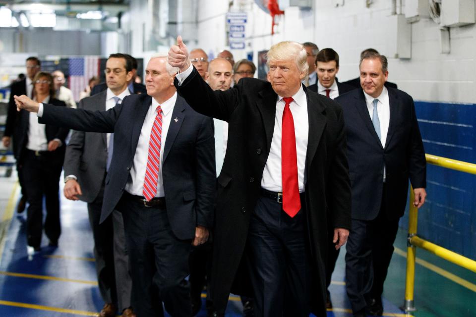 Donald Trump and Mike Pence, then the president-elect and vice president-elect, visit the Carrier factory in Indianapolis in December 2016.