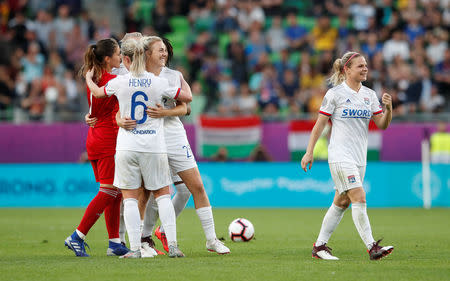 Soccer Football - Women's Champions League Final - Ferencvaros Stadium, Budapest, Hungary - May 18, 2019 Olympique Lyonnais' Amandine Henry celebrates winning the Women's Champions League with team mates after the match REUTERS/Bernadett Szabo