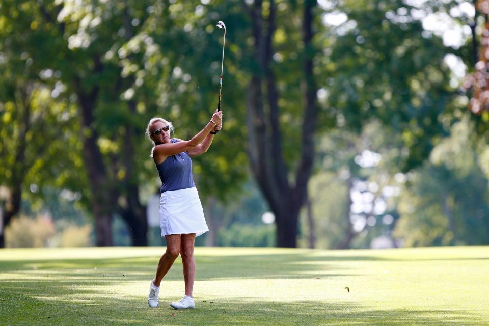 Amy McCoog tracks the flight of the ball after pitching onto the green at the 43rd Annual Country Club of New Bedford Women's Invitational Four-Ball.