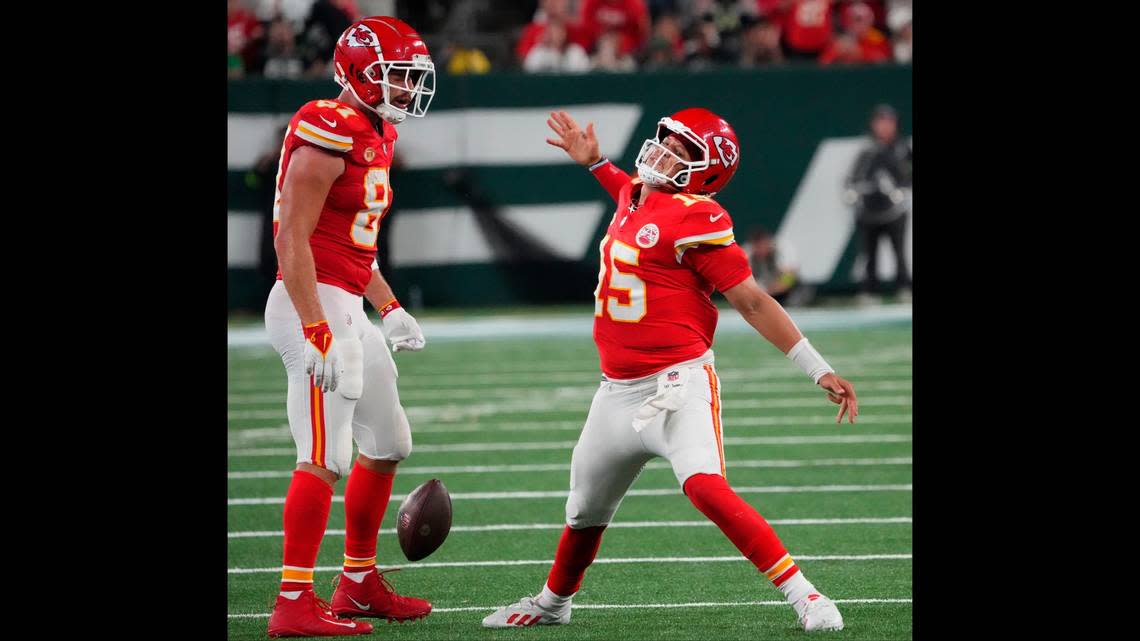Chiefs quarterback Patrick Mahomes, right, was fired up after collecting a crucial first down on a fourth-down keeper late in Sunday night’s game against the New York Jets at MetLife Stadium.