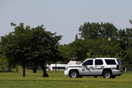 A New Jersey State Park Police car patrols near the entrance to Liberty State Park during a partial state government shutdown in Jersey City, New Jersey U.S., July 3, 2017. REUTERS/Brendan McDermid