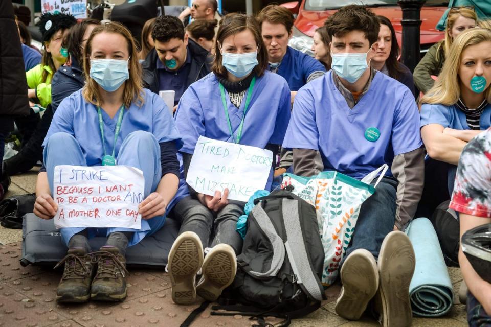 Junior doctors in a silent protest outside Bristol Royal Infirmary (PA) (PA Archive)