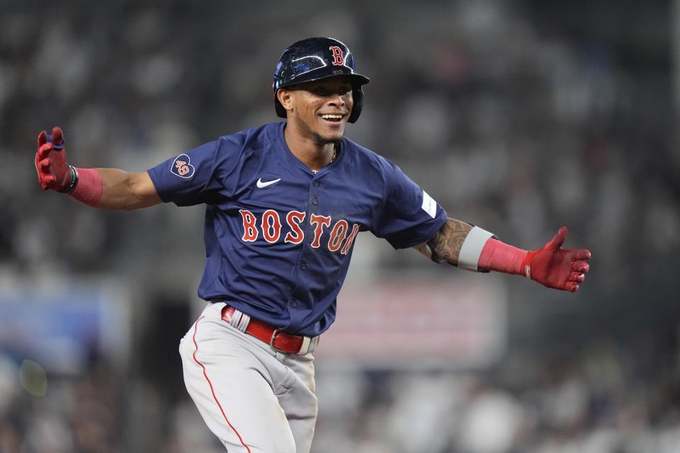 Boston Red Sox's Ceddanne Rafaela (43) gestures toward treammates as he runs the bases after hitting a two-run home run during the tenth inning of a baseball game against the New York Yankees, Friday, July 5, 2024, in New York. The Red Sox won 5-3. (AP Photo/Frank Franklin II)