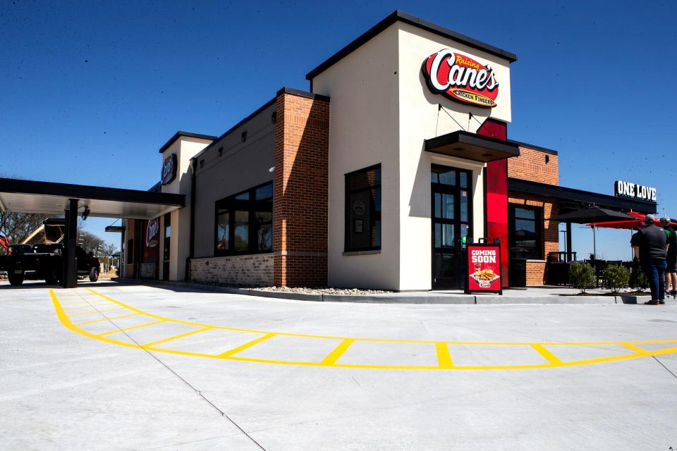 The facade is featured of Raising Cane's at The Grove (formerly College Square shopping center) in Newark, Thursday, April 13, 2023. 
