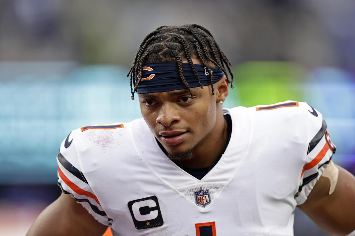 Chicago Bears quarterback Justin Fields (1) walks off the field an NFL football game against the New York Giants on Sunday, Oct. 2, 2022, in East Rutherford, N.J. (AP Photo/Adam Hunger)