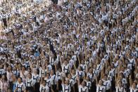 Thousands of students and faculty members dance to the theme song of the One Billion Rising campaign in the quadrangle of the St. Scholastica college in Manila February 14, 2013. One Billion Rising is a global campaign to call for an end to violence against women and girls, according to its organisers. REUTERS/Romeo Ranoco (PHILIPPINES - Tags: POLITICS SOCIETY EDUCATION TPX IMAGES OF THE DAY)