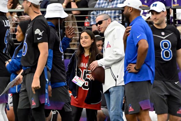 Chase Sui Wonders and Pete Davidson stand on the sidelines during the flag football event at the NFL Pro Bowl last month.