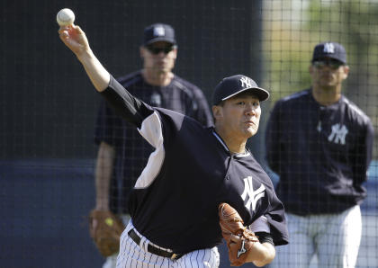 Tanaka throws during batting practice Monday in Tampa, Fla. (AP)