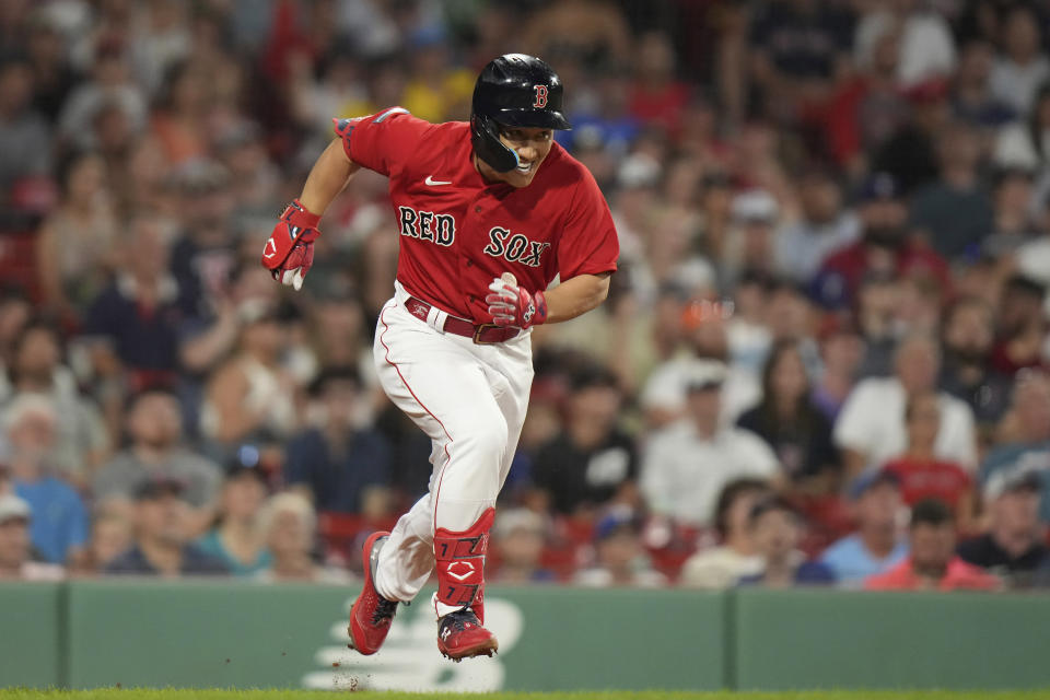 Boston Red Sox's Masataka Yoshida runs to first after hitting an RBI single in the seventh inning of a baseball game against the Texas Rangers, Thursday, July 6, 2023, in Boston. (AP Photo/Steven Senne)