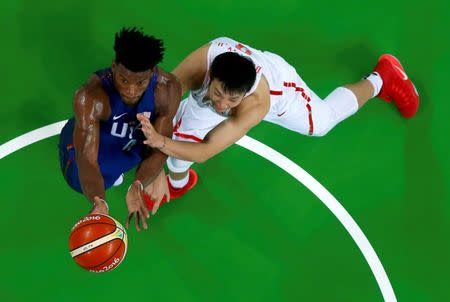 Jimmy Butler (USA) of the USA and Ding Yanyuhang (CHN) of China (PRC) in action. REUTERS/Jim Young