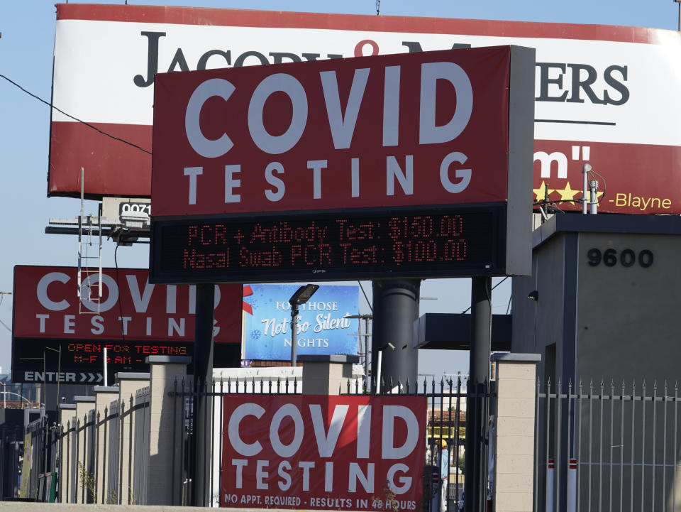 Advertisements for Covid-19 testing ares posted outside Los Angeles International Airport in Los Angeles, Friday, Nov. 13, 2020. California has become the second state to record 1 million confirmed coronavirus infections. The governors of California, Oregon and Washington issued travel advisories Friday, Nov. 13, 2020, urging people entering their states or returning from outside the states to self-quarantine to slow the spread of the coronavirus, California Gov. Gavin Newsom's office said. The advisories urge people to avoid non-essential out-of-state travel, ask people to self-quarantine for 14 days after arriving from another state or country and encourage residents to stay local, a statement said. (AP Photo/Damian Dovarganes)