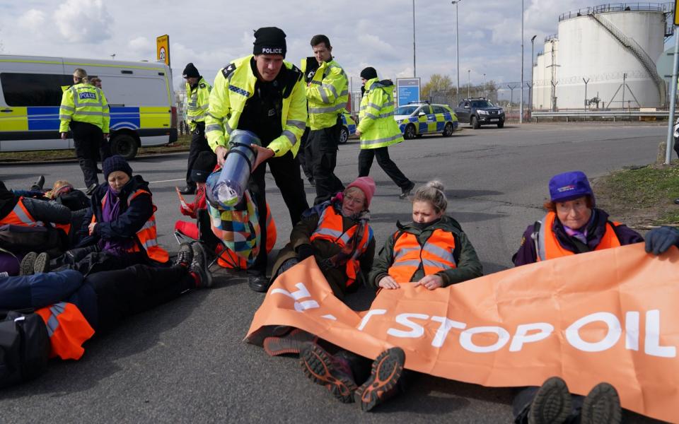 Just Stop Oil activists take part in a blockade at the Kingsbury Oil Terminal, Warwickshire - Jacob King/PA