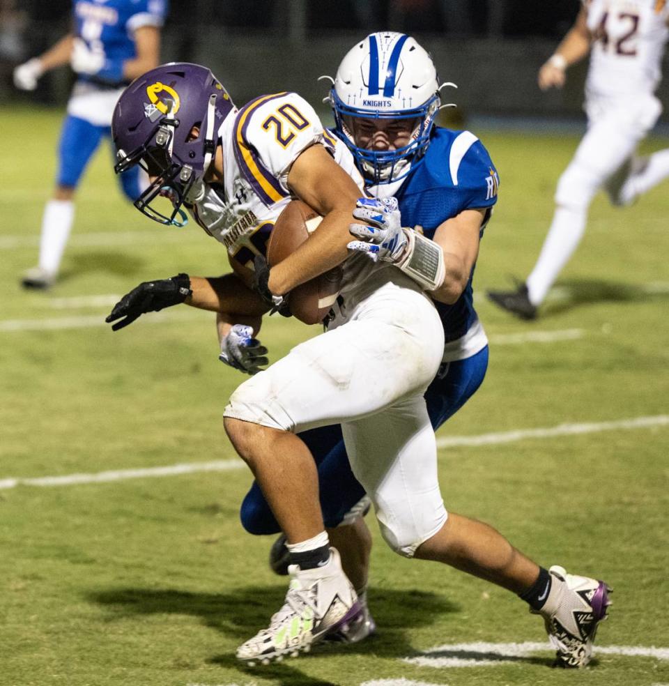 Ripon Christian’s Trevor Van Elderen stops Orestimba’s Drew Felber during the Southern League game in Ripon, Calif., Friday, Sept. 22, 2023.