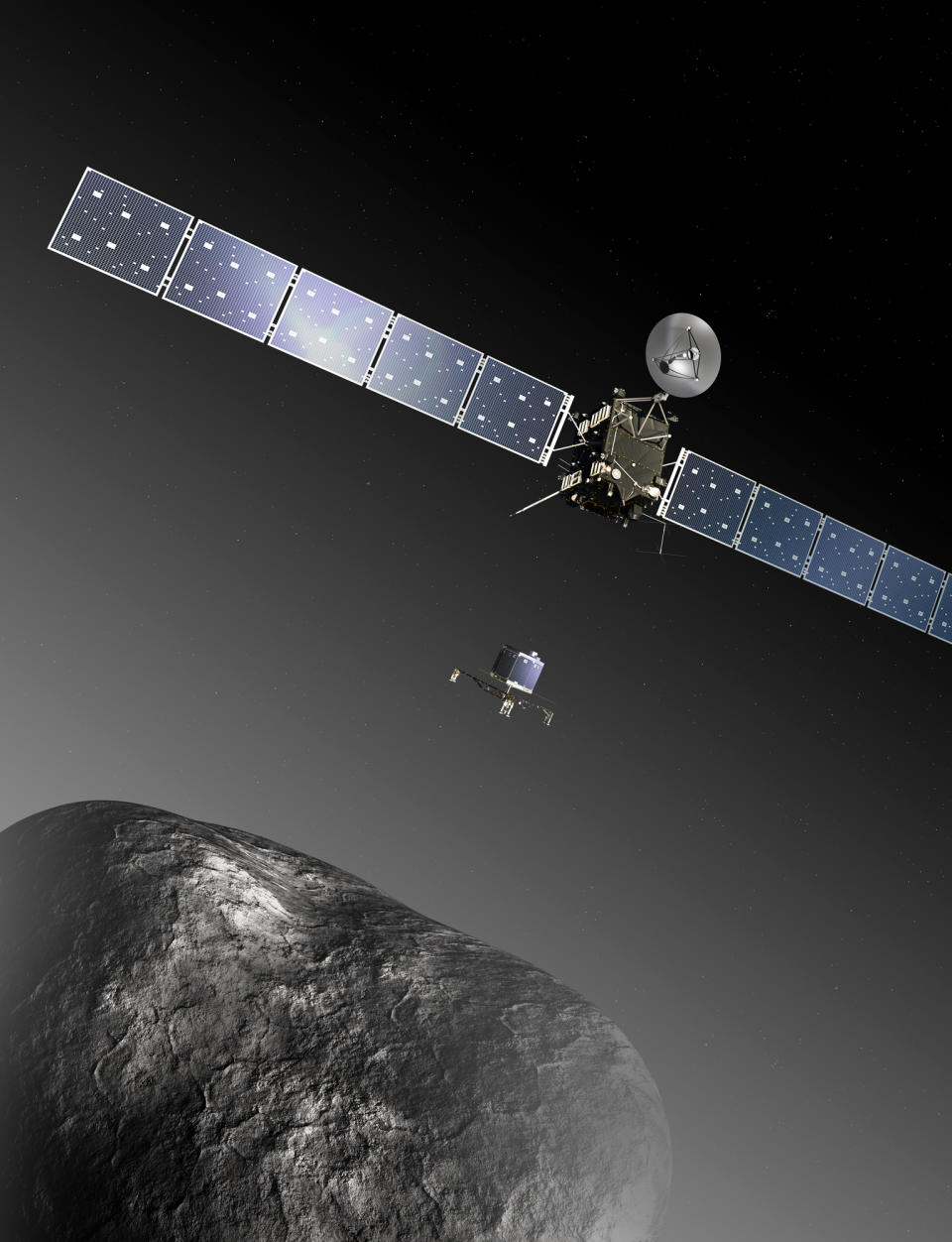 FILE - This image provided by the European Space Agency ESA shows an artist’s impression of the Rosetta orbiter deploying the Philae lander to comet 67P/Churyumov–Gerasimenko. The image is not to scale; the Rosetta spacecraft measures 32 m across including the solar arrays, while the comet nucleus is thought to be about 4 km wide. Scientists at the European Space Agency are expecting their comet-chasing probe Rosetta to wake from almost three years of hibernation at 11 a.m. Monday Jan. 20, 2014 (1000 GMT; 5 a.m. EST) and phone home to say all is well. (AP Photo/ESA, C.Carreau, File)