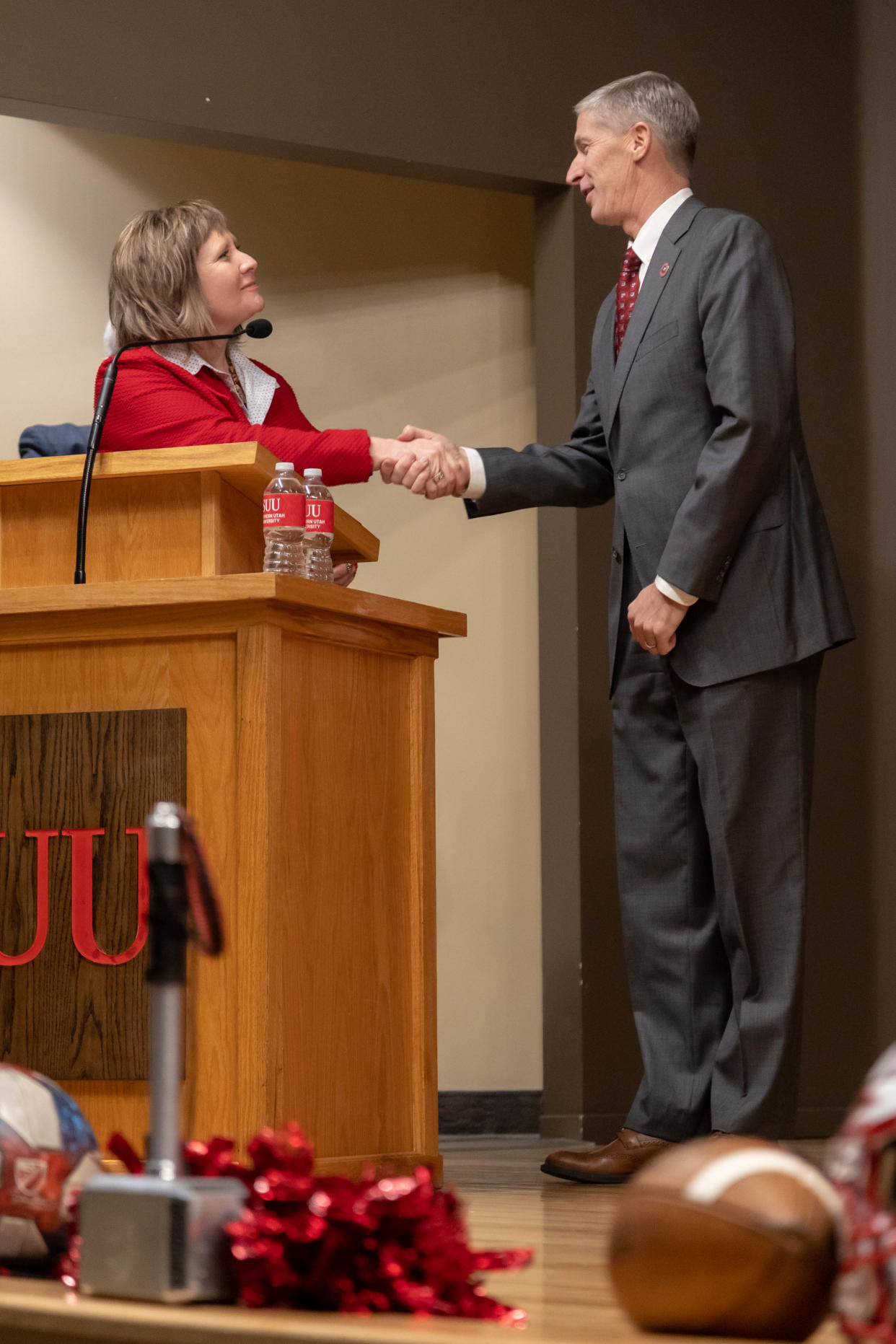 Southern Utah University President Mindy Benson shakes hands with Doug Knuth during a press conference to announce that he would become the school’s new athletic director.