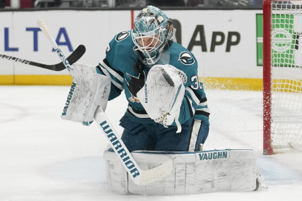 San Jose Sharks goaltender Kaapo Kahkonen (36) stops a shot during the second period of an NHL hockey game against the Los Angeles Kings Monday, Jan. 22, 2024, in Los Angeles. (AP Photo/Ashley Landis)