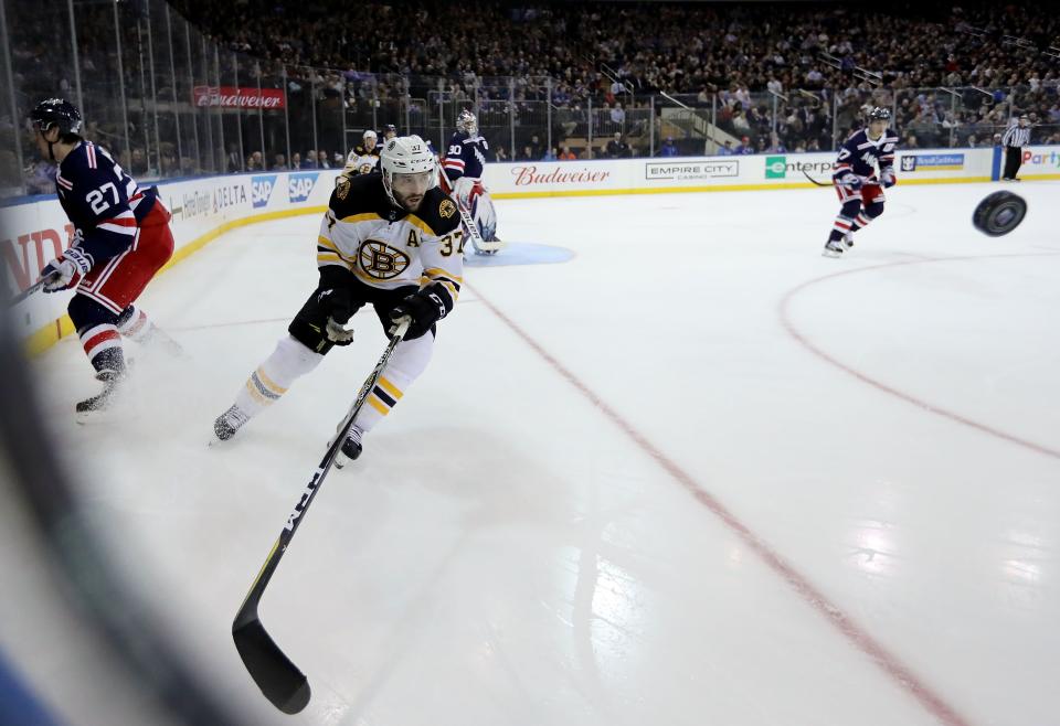 <p>NEW YORK, NY - FEBRUARY 07: Patrice Bergeron #37 of the Boston Bruins chases the puck in the first period against the New York Rangers during their game at Madison Square Garden on February 7, 2018 in New York City. (Photo by Abbie Parr/Getty Images)</p>