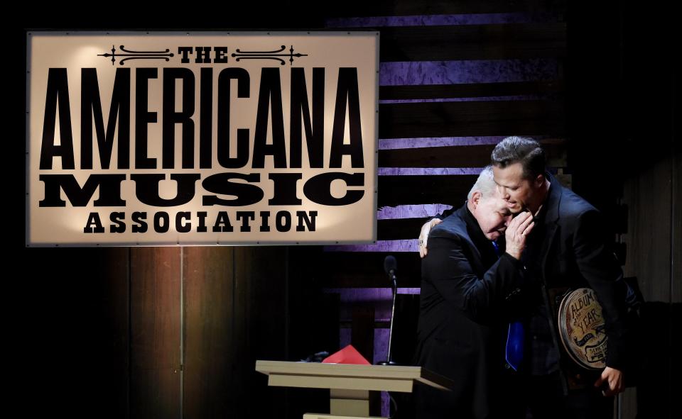 John Prine, left, and Jason Isbell hug after Prine presented Isbell with Album of the Year award during the 15th annual Americana Honors & Awards show at the Ryman Auditorium Sept. 21, 2016.