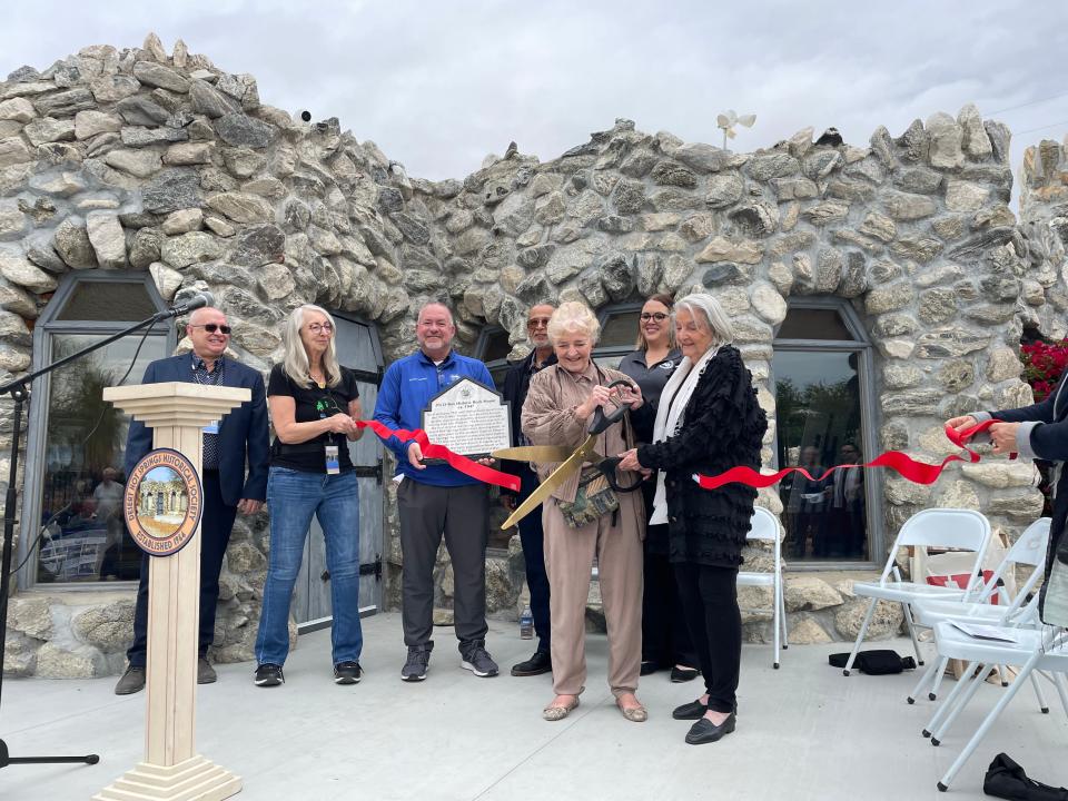 Members of the Desert Hot Springs Historical Society and local leaders gather for a ribbon cutting at the Historic Rock House in Desert Hot Springs on Saturday, Jan. 20, 2024.