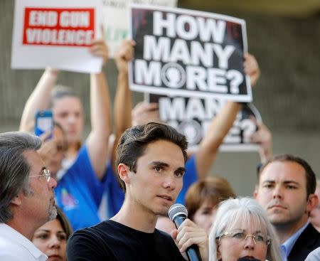 David Hogg, a senior at Marjory Stoneman Douglas High School, speaks at a rally calling for more gun control three days after the shooting at his school, in Fort Lauderdale, Florida, U.S., February 17, 2018. REUTERS/Jonathan Drake/Files