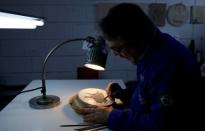 Nelson Carneiro, craftsman from the Casa da Moeda do Brasil (Brazilian Mint) works on the Rio 2016 Olympic medal mold in Rio de Janeiro, Brazil, June 28, 2016. REUTERS/Sergio Moraes