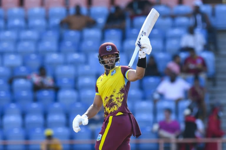 Brandon King celebrates his half century en route to an unbeaten 82 for West Indies in the second T20 international against England on Thursday (Randy Brooks)