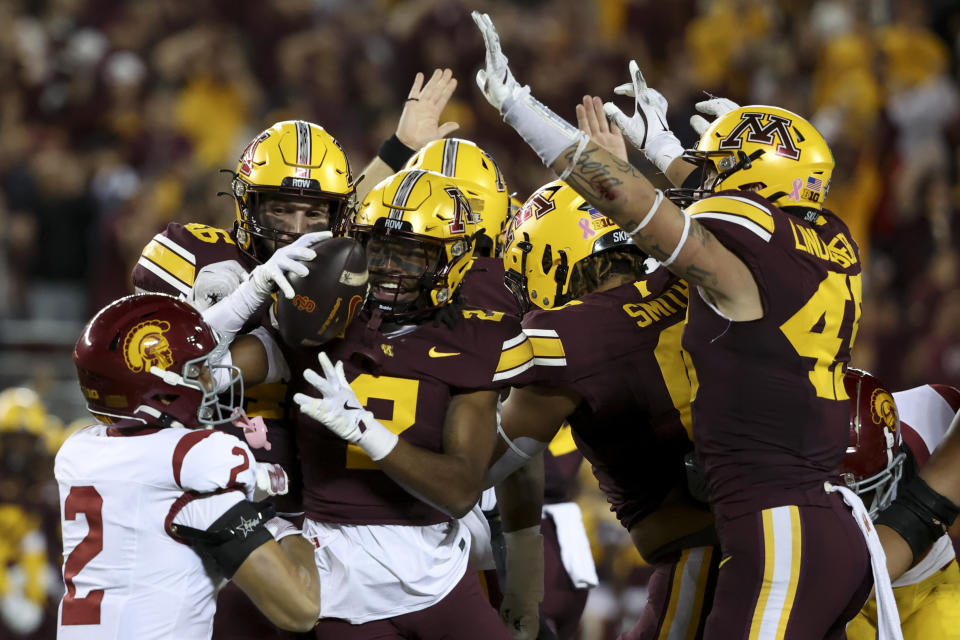 Minnesota defensive back Ethan Robinson celebrates as he recovers a Southern California fumble during the first half of an NCAA college football game, Saturday, Oct. 5, 2024, in Minneapolis. (AP Photo/Ellen Schmidt)