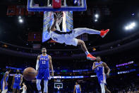 Orlando Magic's Paolo Banchero (5) dunks the ball during the second half of an NBA basketball game against the Philadelphia 76ers, Monday, Jan. 30, 2023, in Philadelphia. (AP Photo/Matt Slocum)