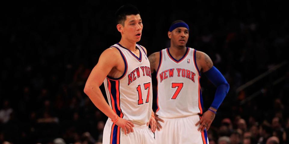 Jeremy Lin and Carmelo Anthony stand with their hands on their hips during a Knicks game in 2012.