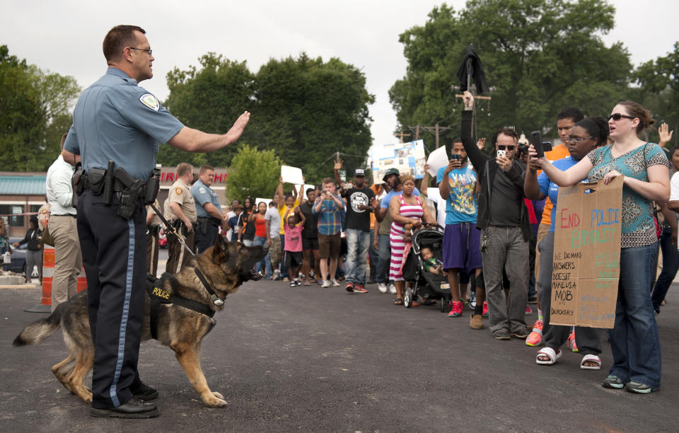 Protesters confront police during an impromptu rally&nbsp;on&nbsp;Aug. 10, 2014.